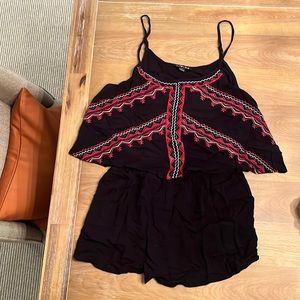 Black with red pattern romper